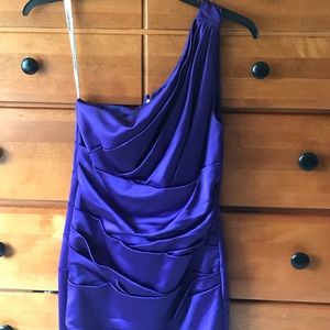 Purple form fitting bridesmaid dress.